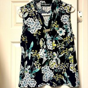 Add a touch of elegance with this pearl-embellished neck-tie sleeveless blouse